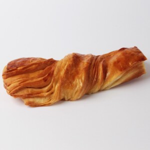 Tortillon nature beurre, une pâtisserie croustillante et fondante au beurre, idéale pour accompagner votre café ou votre thé.